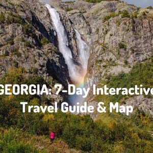 May include: A digital travel guide titled GEORGIA: 7-Day Interactive Travel Guide & Map, featuring a photograph of a tall waterfall cascading down a rocky mountain cliff with a visible rainbow at the base and a person in a pink jacket below.