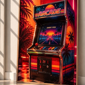 Puede incluir: Una impresión enmarcada de una máquina recreativa con un atardecer vibrante, siluetas de palmeras y un gráfico de carretera. La marquesina muestra la palabra ARCADE, mientras que la pantalla exhibe el texto INSERT COIN sobre un juego retro.