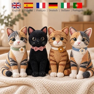 May include: Four crocheted cat figurines sitting in a row. The cats are calico, solid black, orange tabby, and calico. Each cat wears a crocheted collar with a small flower or bow detail. They have large dark eyes, stitched noses, and whiskers.