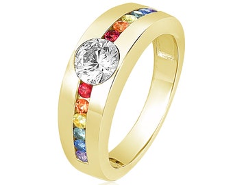 May include: A gold band ring with a large round center stone and a row of colorful gemstones around the band.