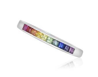 May include: A silver band ring with a rainbow of square-shaped gemstones set in a row.