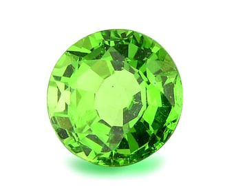 May include: A bright green gemstone with a round, faceted cut. The gem is set against a white background.