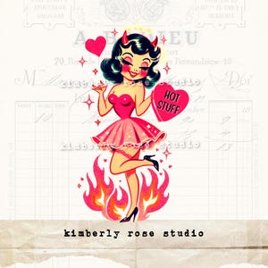 May include: A cartoon illustration of a pink-haired devil woman with a halo, wearing a pink dress and holding a heart-shaped candy that says "HOT STUFF". She is standing on flames with glitter.