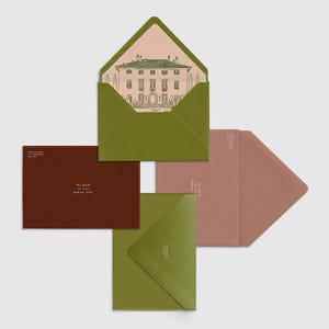 May include: A collection of stationery, including envelopes and cards in green, brown, and pink. One envelope is open, displaying a building illustration. The stationery features printed text.