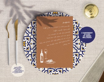 May include: A rectangular brown menu card with white cursive text and line art of a bottle, glass, and plate. It rests on a round plate featuring a blue, yellow, and white pattern. A gold fork and knife are placed to the left of the plate.