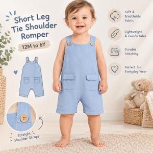 May include: A light blue short leg romper with tie shoulder straps, featuring two front pockets with flaps and wooden buttons. The garment is labeled as a Short Leg Tie Shoulder Romper for sizes 12M to 6Y, highlighting straight shoulder straps.