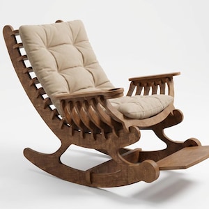 May include: A wooden rocking chair with a brown finish, featuring a slatted backrest design and a beige tufted cushion. The chair includes integrated armrests with a built-in cup holder on one side and a footrest extending from the base.