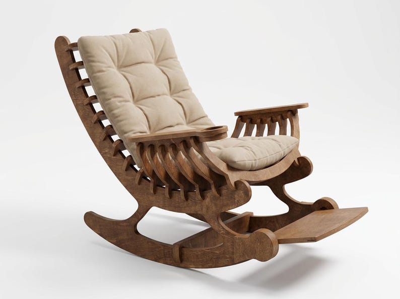 May include: A wooden rocking chair with a brown finish, featuring a slatted backrest design and a beige tufted cushion. The chair includes integrated armrests with a built-in cup holder on one side and a footrest extending from the base.