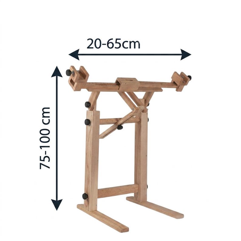 May include: A light brown wooden floor stand with adjustable clamps and support arms. The stand features black adjustment knobs and is labeled with dimensions of 20-65cm for width and 75-100cm for height, indicating its adjustable range.