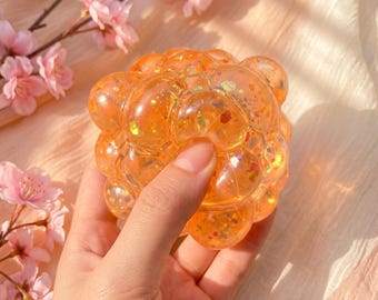 Glitterende squishybal, langzaam terugverend kawaii fidget toy, pastelkleurige glitter bureau speelgoed