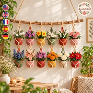 May include: A wall hanging featuring a natural wooden branch suspending twelve crocheted plant pots in two rows. Each pot contains a different variety of colourful crocheted flowers, including roses, daisies, daffodils, and poinsettias, held by rope.