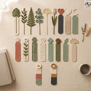 May include: A collection of nineteen crocheted bookmarks in various shapes and earthy tones. The designs include botanical elements like leaves, flowers, hearts, and moons, featuring textures in cream, sage green, olive, terracotta, and dark grey yarn.