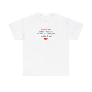 May include: A white short-sleeve t-shirt featuring a red and black graphic on the chest. The text reads THE RADIO DEPT., SMRT FAŠIZMU, DEATH TO FASCISM, and Arabic script, followed by a small red graphic consisting of three horizontal curved lines.