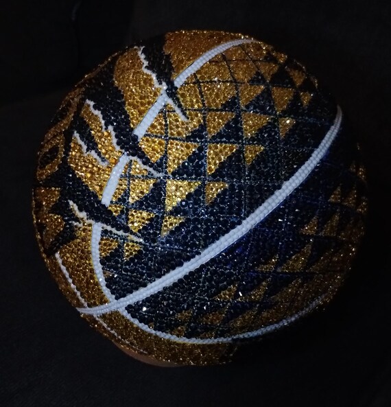 A full-size basketball encrusted in custom rhinestones — this is ostentatious, over-the-top display art that you genuinely cannot buy at a store.