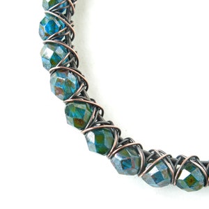 Copper wire wrapped bracelet peacock blue teal faceted luster glass beads