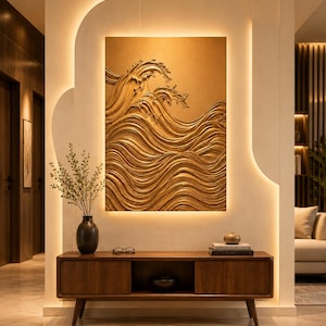 May include: A rectangular wall art piece featuring a gold-toned, three-dimensional relief of crashing ocean waves. The artwork is mounted on a light-colored wall with integrated backlighting that illuminates the textured surface of the waves.