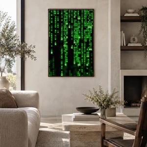 May include: A rectangular wall art piece featuring a digital matrix design with glowing green characters and symbols cascading vertically against a solid black background, enclosed within a thin, dark brown frame.