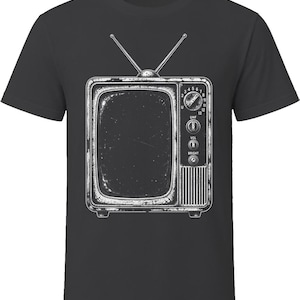 May include: A charcoal gray short-sleeve t-shirt featuring a white graphic print of a vintage television set. The illustration includes two antennas, a channel dial, and knobs labeled UHF, VOL, and BRIGHT, rendered in a distressed line art style.
