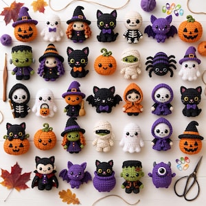 May include: A collection of thirty small crocheted Halloween figures including pumpkins, ghosts, black cats, skeletons, mummies, bats, spiders, and witches. The figures are arranged in a grid on a white surface with scattered autumn leaves.