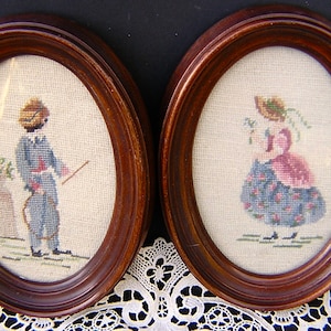 Pair of Colonial Couple Framed Needlepoints in Oval Frames