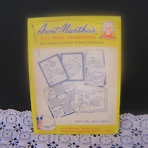 May include: Aunt Martha's Hot Iron Transfers booklet, featuring illustrations of bears. The yellow cover displays the text "The Bear Family" and is designed for embroidery, textile painting, and other art crafts.