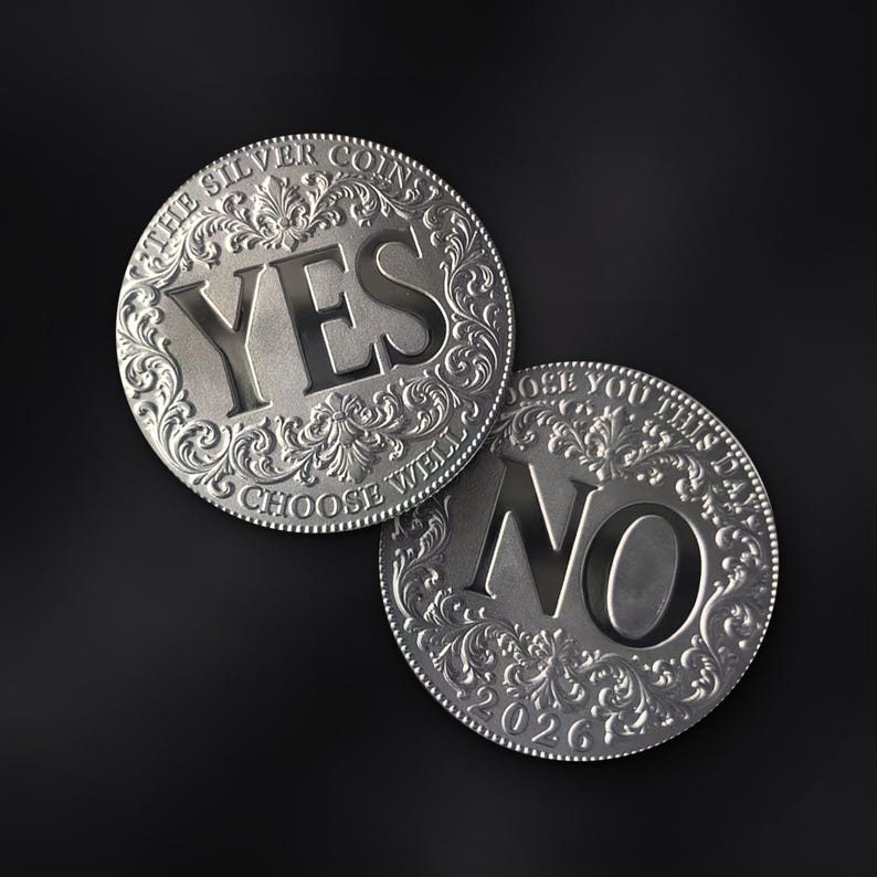 May include: Two circular silver-toned metal coins featuring ornate floral engravings along the edges. One coin displays the word YES with the text THE SILVER COINS and CHOOSE WELL. The other coin displays the word NO with the text CHOOSE YOU THIS DAY and 2026.