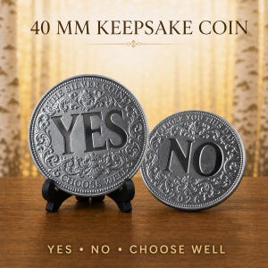 May include: Two circular silver-toned metal coins featuring ornate scrollwork borders. The larger coin on a black stand displays the word YES and the text THE SILVER COIN CHOOSE WELL. The smaller coin displays NO and CHOOSE YOU THIS DAY 2026.
