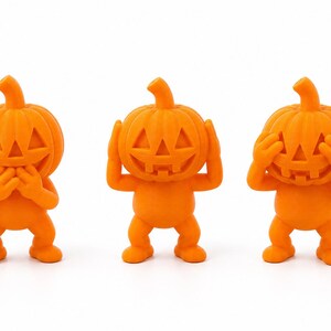 May include: Three bright orange figurines with carved pumpkin heads and humanoid bodies. The first figure covers its mouth with both hands, the second figure covers its ears with both hands, and the third figure covers its eyes with both hands.