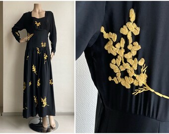 Antique 1930s black rayon crepe dress with yellow wool and silk mimosa applications