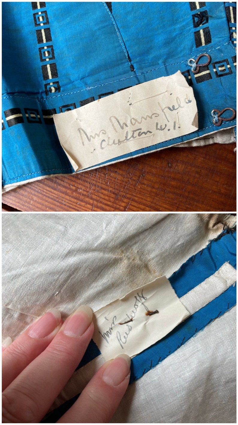 May include: Two handwritten labels sewn onto a blue and white fabric. The first label reads "Mrs. Hampshire, Clinton, W.I." The second label reads "Mrs. Reese, Rustoff".