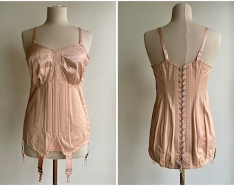 Vintage 1950s salmon pink lace up boned corselet with satin cups and garters