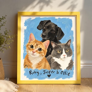 May include: A framed painting featuring a black dog, an orange tabby cat, and a grey and white cat against a blue background. The text "Ruby, Jasper & Ollie" is written in black below the animals, accompanied by a small black heart symbol.