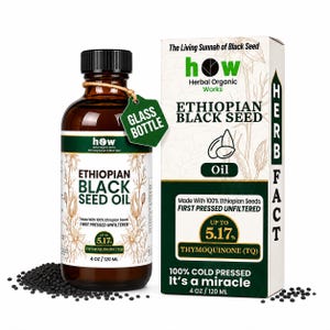 May include: An amber glass bottle and a white rectangular box of Ethiopian Black Seed Oil. The labels feature the text Herbal Organic Works, 5.17% Thymoquinone, and 4 oz / 120 ml. Small black seeds are scattered around the base of the items.