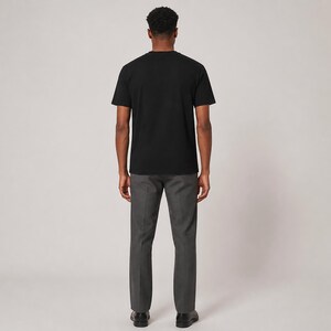 Software Developer Debugging design graphic T-shirt in black, model blank back