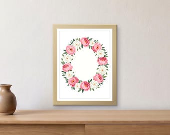 May include: A rectangular wall art print in a gold frame featuring a central oval wreath composed of pink and white peony flowers with green leaves on a white background. The floral arrangement is symmetrical and centered within the frame.