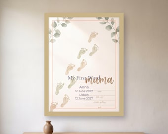 May include: A framed wall art print featuring a trail of watercolor baby footprints, green eucalyptus leaves, and the text My First Word mama, Anna, 12 June 2027, Lisbon, 12 June 2027, with blank lines for phonetic spelling and date.