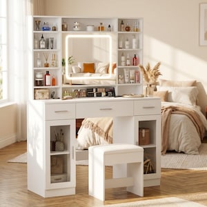 May include: A white vanity table featuring a central square LED-lit mirror, multiple open storage shelves filled with various bottles and containers, three drawers, two lower cabinets with glass doors, and a matching white upholstered stool.