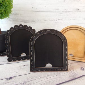 Arched frames for the small seasonal arched inserts, Interchangeable signs