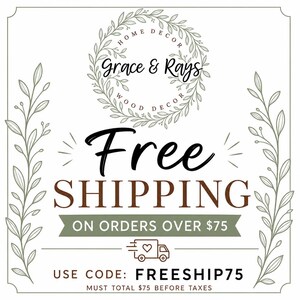 May include: A square graphic with a white background and olive green leaf borders. At the top, a circular wreath surrounds the text Grace & Rays Home Decor Wood Decor. The center features the text Free Shipping on orders over $75 with a truck icon.