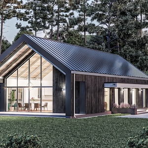 Può includere: Una casa moderna con rivestimento in legno verticale scuro e un tetto a due falde in metallo nero. La facciata presenta una grande parete vetrata triangolare che rivela una sala da pranzo interna e un ingresso coperto con tettoia bianca.