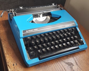 vintage 1970s Blue silver reed manual typewriter in good condition with new ribbon fitted,fully working.Free UK postage