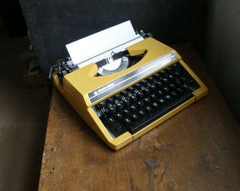 Fab Yellow silver reed manual typewriter in great condition with new ribbon fitted,fully working.Free UK postage