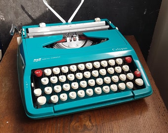 Retro turquoise,blue two tone, smith corona Calypso manual Typewriter in good condition with case ,Free UK postage