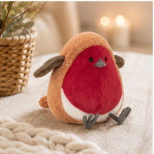 May include: A plush robin bird toy featuring a round, soft body with brown fur on the back and wings, a bright red chest, and a white belly. The bird has small black eyes, a grey beak, and grey feet, designed with a rounded, plump silhouette.