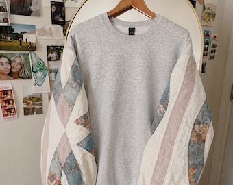 Sudadera con mangas acolchadas