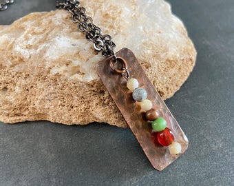 Hammered Copper Pendant Necklace with Carnelian, Mother-of-Pearl, Glass, and Feldspar stones. Gunmetal Chain.