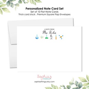 May include: A set of 10 personalized note cards with a science theme. The cards feature a watercolor illustration of beakers, a microscope, and a molecule. The text "A Note From Mrs. Kechn" is printed on the card. The cards are printed on thick card stock and come with premium square flap envelopes.