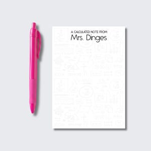 May include: A bright pink retractable ballpoint pen positioned next to a rectangular notepad. The notepad features the black printed text A CALCULATED NOTE FROM Mrs. Dinges and a faint, light gray background pattern of various mathematical symbols.