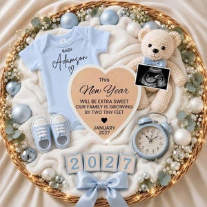 May include: A baby announcement set in a wicker basket featuring a light blue onesie with Baby Adamson text, a crochet teddy bear with a sonogram, light blue baby shoes, a heart-shaped sign reading This New Year Our Family Is Growing, and 2027 blocks.