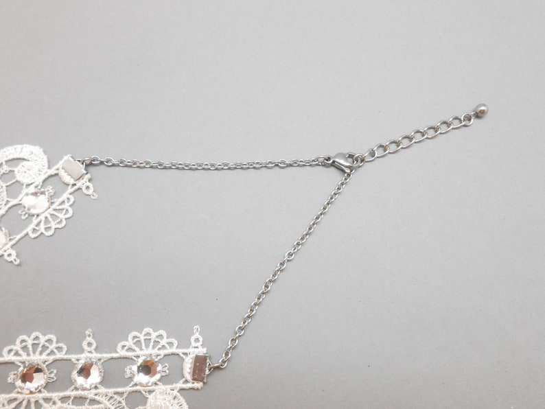 White lace neck tower with crystal rhinestones